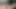 Altın bronzlaşmış orta yaşlı seksi kadın sigara içiyor ve üvey oğlunun yarağına bakıyor