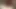 Güzel bir esmer büyük göğüslerini öperken kız arkadaşının amına dildo sokuyor