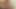 Seksi Asyalı yatak odasında soyunuyor ve oynuyor