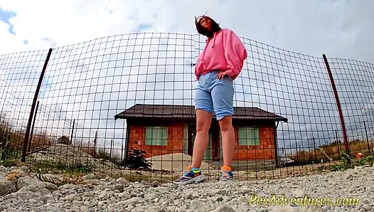 Hipster girl pee in her jeans - changing her wet shorts into dry pants
