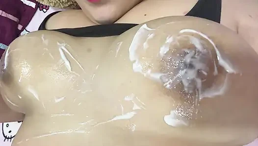 Mom massages her big tits with a very delicious cream