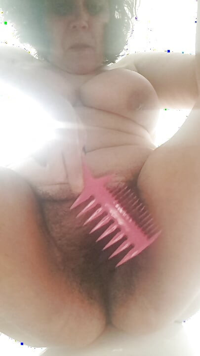 combing the hairy pussy of a milf