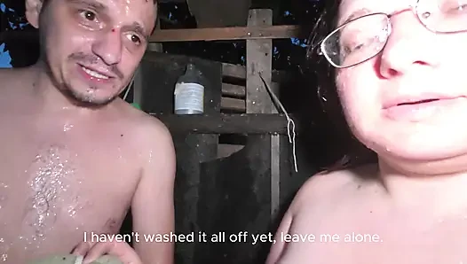 Soapy naked bodies in a rural shower