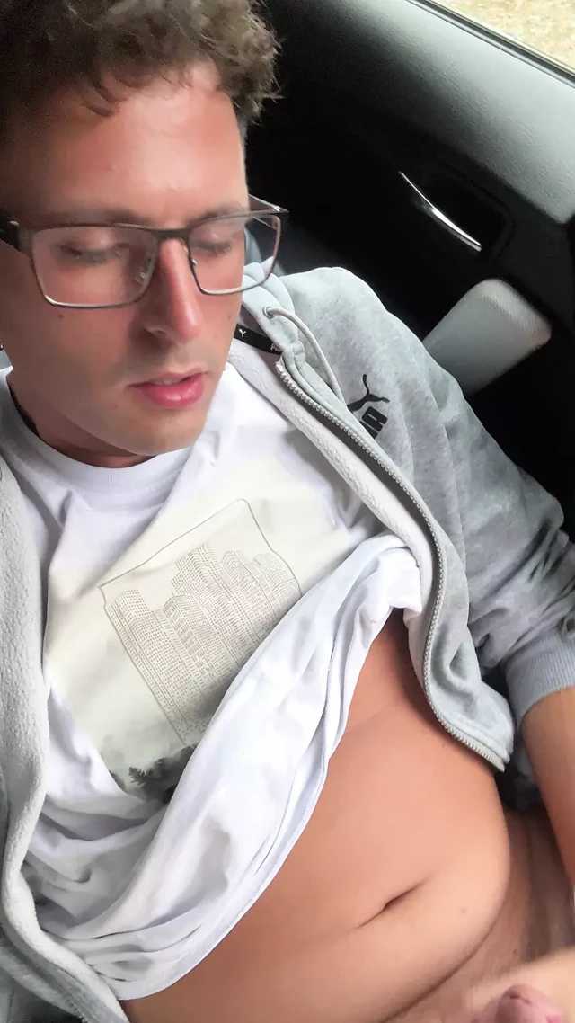 Really cute twink boy jerks off his stinky cheese-smeared penis outside in the car until he cums