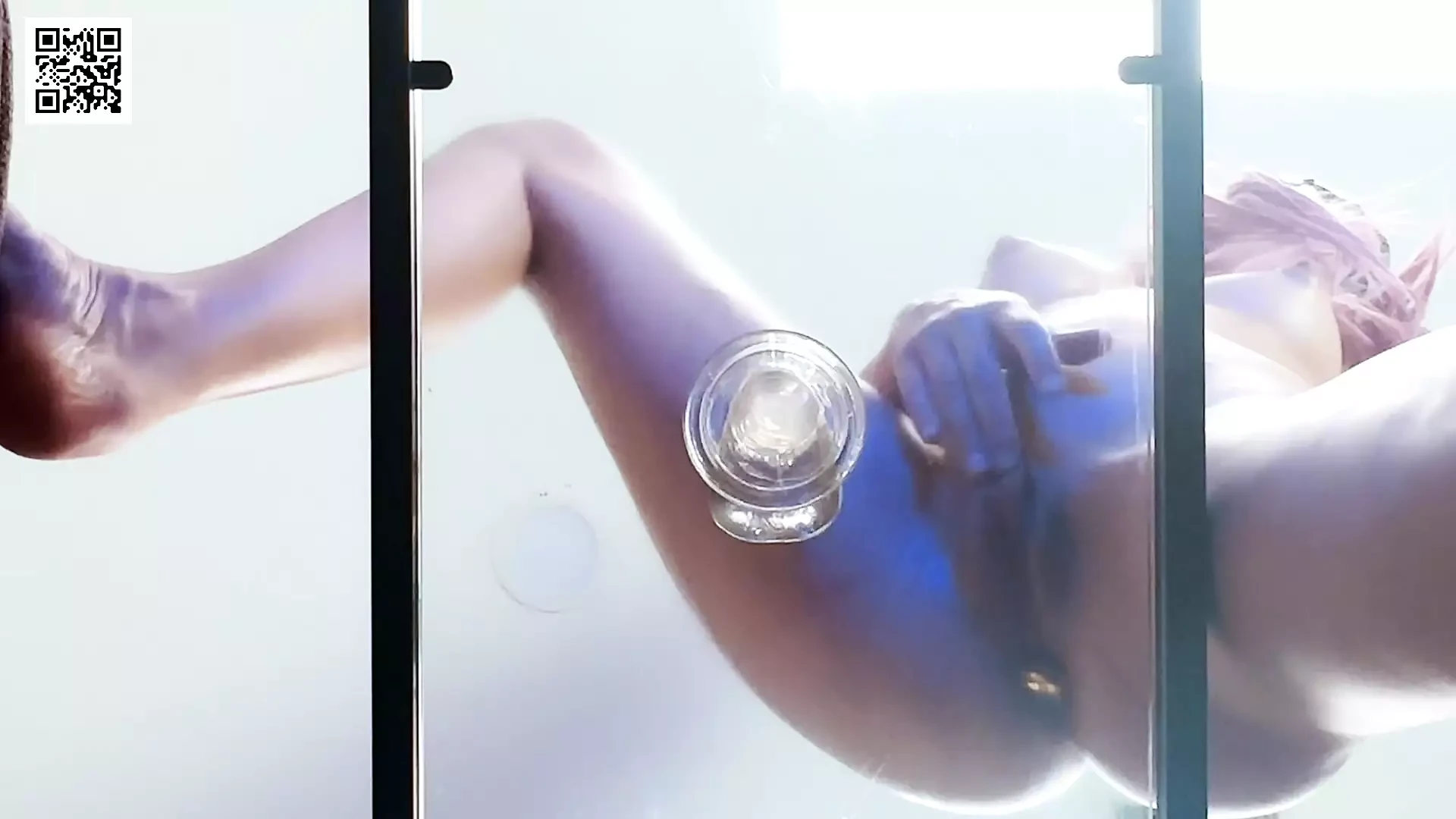 Riding transparent dildo on a glass table