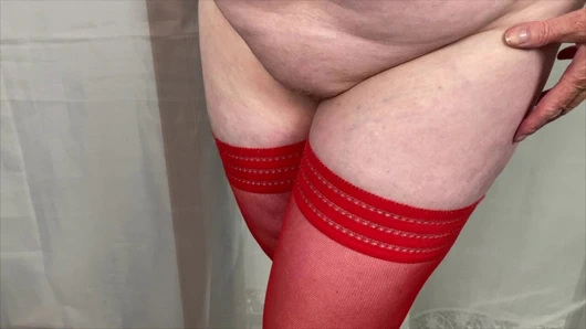 Mrs Mature Feet wearing her sexy red fishnet hold ups and wearing her waspie