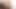 Redhead ladyboy in black lingerie jerks off her small cock