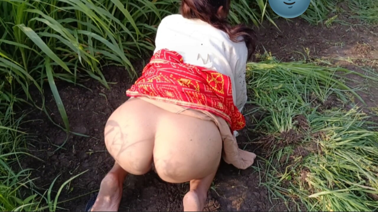 My elder sister-in-law is tormenting in the field of millet by undressing her clothes and putting fingers in her pussy.
