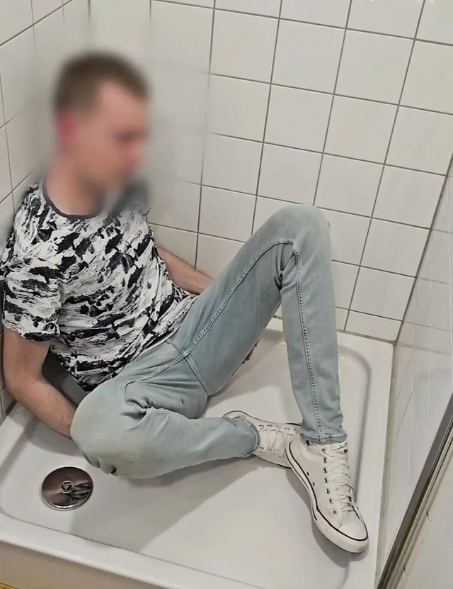 Playing in shower fully clothed in jeans and chucks