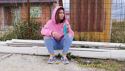 Hipster girl pee in her jeans - changing her wet shorts into dry pants