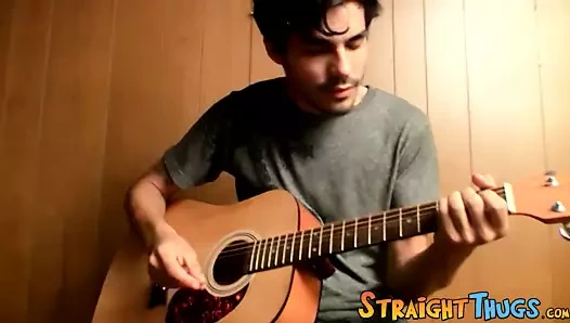 Handsome young man enjoys his guitar and jerkoff solo