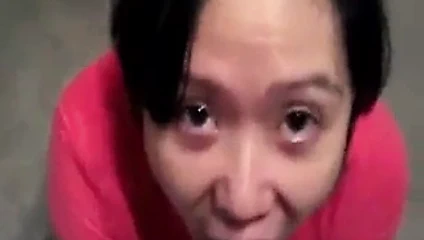 Slanty Eyed Asian Drinking Stranger's Cum