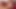 Mavi elbiseli esmer ladyboy kesilmiş horoz ile oynuyor