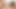 İki seksi genç lezbiyen büyük bir yarakla oynuyor ve sikişiyor