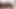 Külotlu çoraplı sekreter sigara içiyor ve ayaklarını yüzüne sokuyor