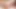 Busty brunette ladyboy in black dress jerks off solo in bed