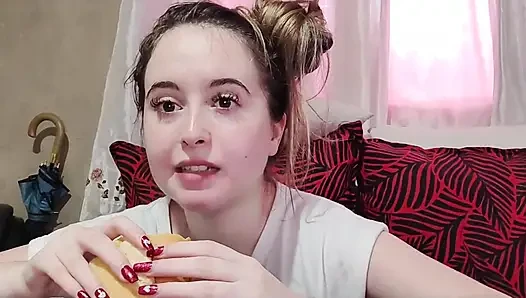 Eating an omelette sandwich with cherry tomatoes