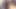Seksi vücut çorapları ve yüksek topuklu ayakkabılar giyen iki büyük memeli ve büyük memeli trans kız yan yana yatakta yatıyor ve büyük göğüslerini okşuyor