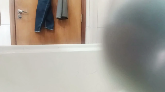 In the bathroom, masturbating with the deodorant