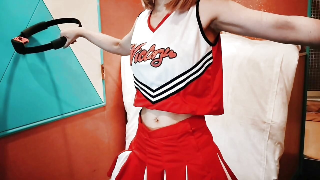 A cute, busty married woman does exercise 1 in an erotic cheerleader costume. Home made amateur Private Shoot