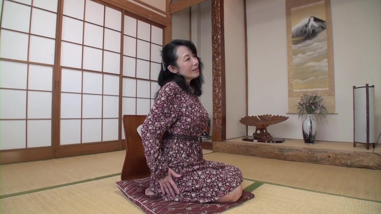 Busty Japanese granny strips and rides cock