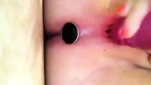 Plug in my asshile while fucking my pussy with a dildo