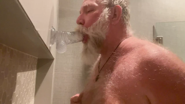 DaddybearAZ deep throats a dildo in the shower