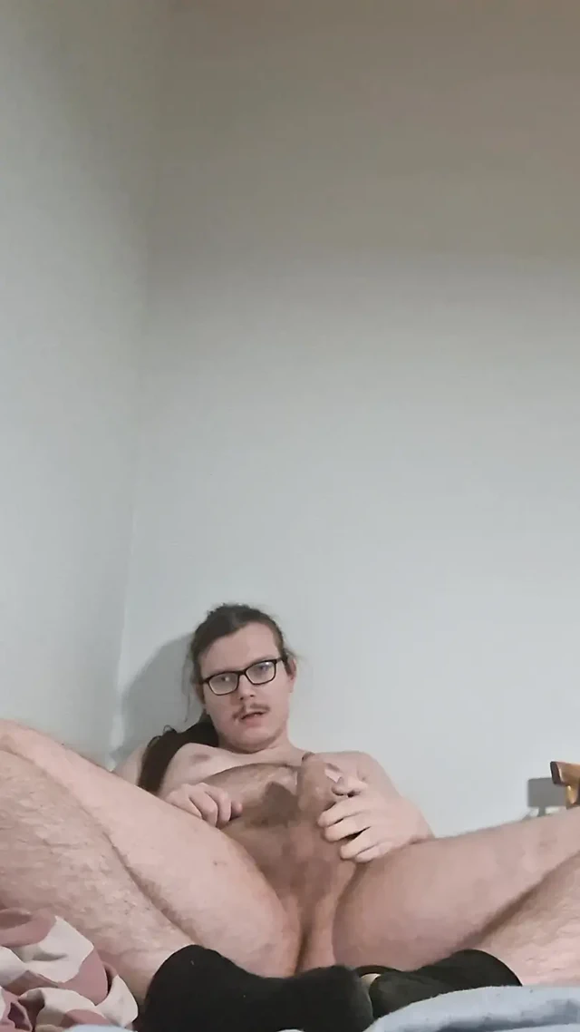 Young boy undressing and jerking off