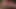 A milf with a large vagina masturbates with her dildo using her feet, then inserts a black dildo.