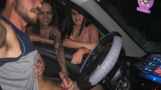 Two hot girls caught him masturbating inside the car and helped him cum