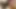 Siyah çoraplı seksi zenci kaltak beyaz sandalyede mastürbasyon yapıyor