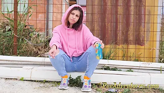 Hipster girl pee in her jeans - changing her wet shorts into dry pants