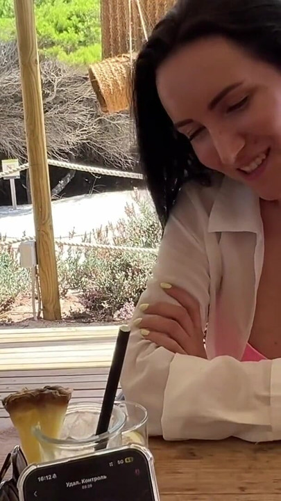 Secret fun with a vibrator on the remote control in public places (in a restaurant, on the beach, in a parking lot) | Clip 1