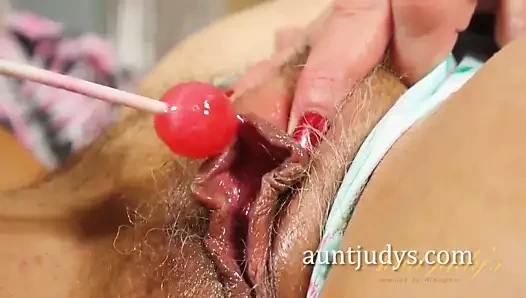 Mature Babe Cristine Ruby Rubs a Lolli On Her Pussy