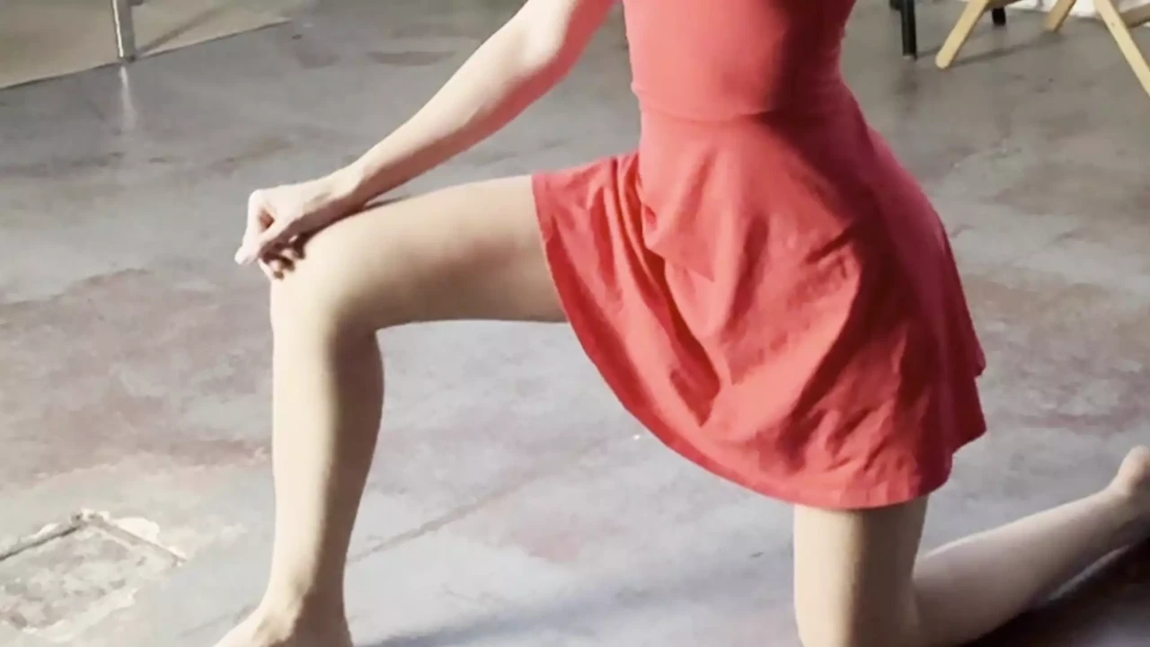 goddess like stretching in red dress