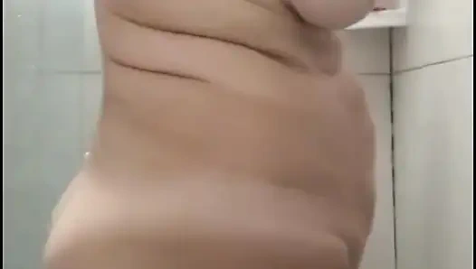 My stepmom taking a shower after fucking, to get the cum out of her.