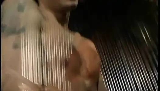 Nyomi Banxxx bends over a slaveboy for butt flogging then has him eat her boots