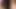 Vollbusige Blondine masturbiert mit grünem Toy
