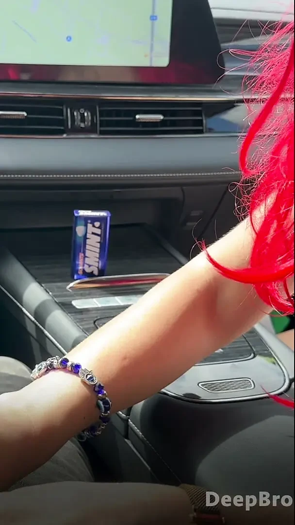 Redhead deepthroats thick BBC in the car, fingers gripping tight
