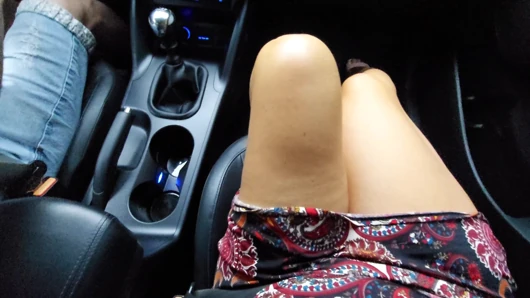 Elegant stepmom in heels and a short skirt in the car in the morning.