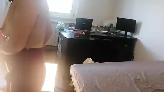 Amateur woman has fun trying on clothes and cutting them. Amateur woman vacuuming naked in the house.