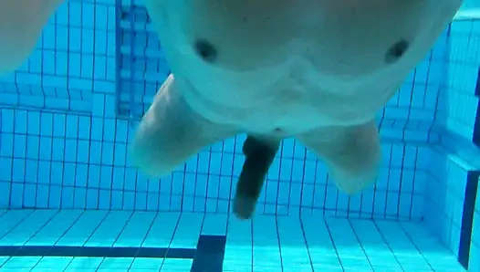 Indoor public pool solo uncut nude fit man swimming
