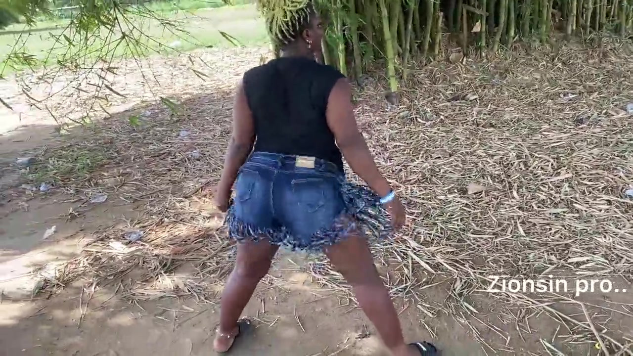 Ebony sexy black girl dances in outdoor with much laughter