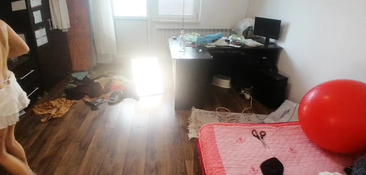 Amateur woman has fun trying on clothes and cutting them.