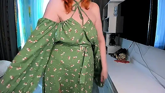 Hot redhead girl slowly undresses  Green floral dress, open back, high slit, stockings and red shoes