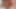 Altın bronzlaşmış orta yaşlı seksi kadın sigara içiyor ve üvey oğlunun yarağına bakıyor