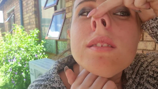 Picking my nose, blowing it and putting the boogers in my mouth to eat them.