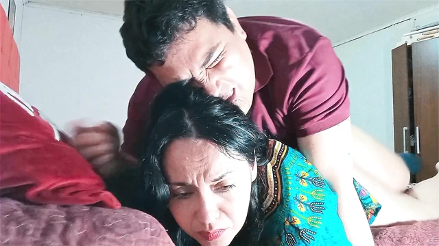 Indian stepmother shares bed with her stepson, they end up fucking hard.
