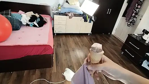 Amateur wife dancing naked at home. Amateur woman has fun trying on clothes and cutting them.