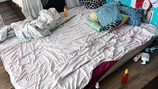 Sensual massage of a sexy couple with oil on the body. Foreplay in the bedroom with an amateur couple.